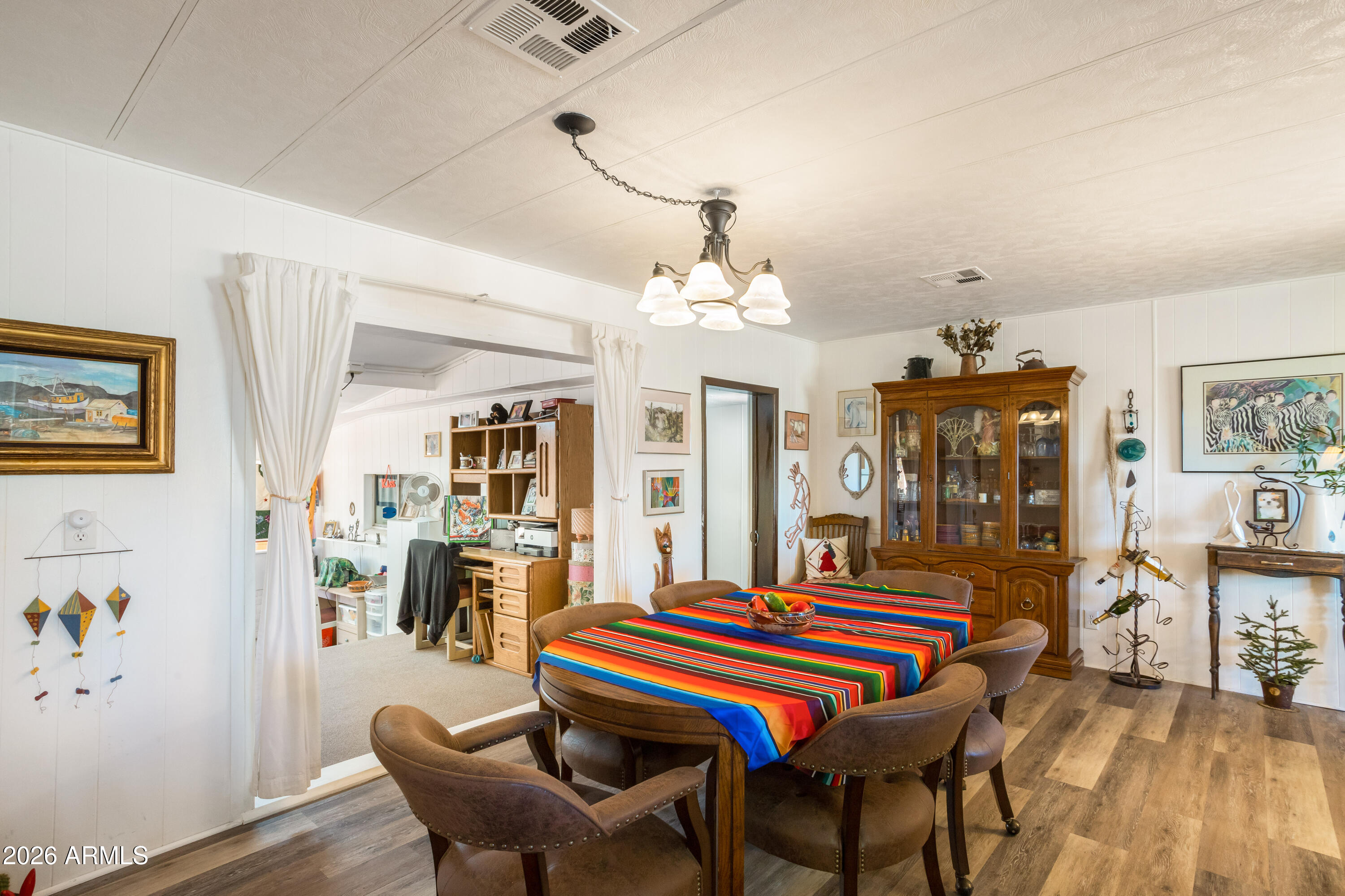 5681 South Moson Road Hereford, AZ 85615 - Photo 35 of 47 a room that has a table and chairs