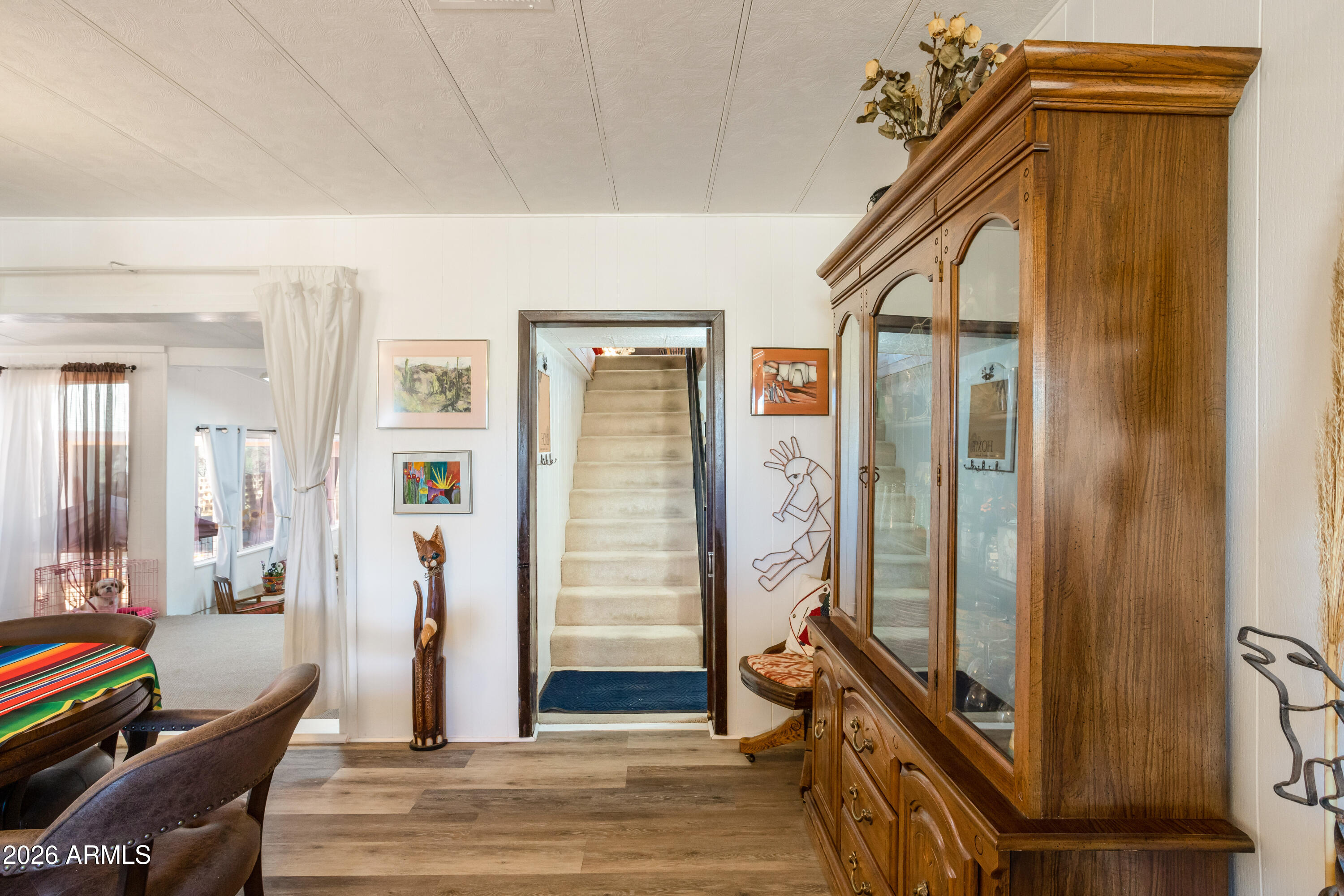 5681 South Moson Road Hereford, AZ 85615 - Photo 36 of 47 a view of a hallway to a livingroom with furniture and windows