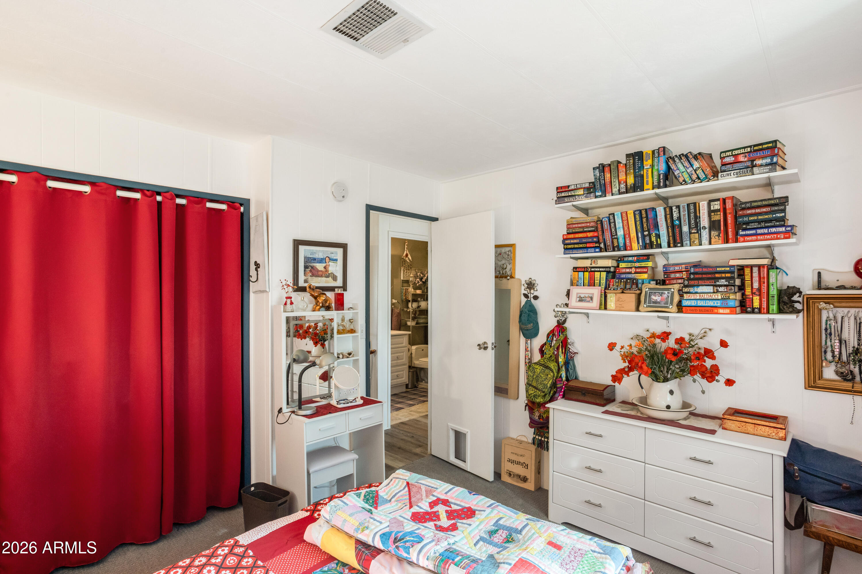 5681 South Moson Road Hereford, AZ 85615 - Photo 43 of 47 a bedroom with furniture and a book shelf