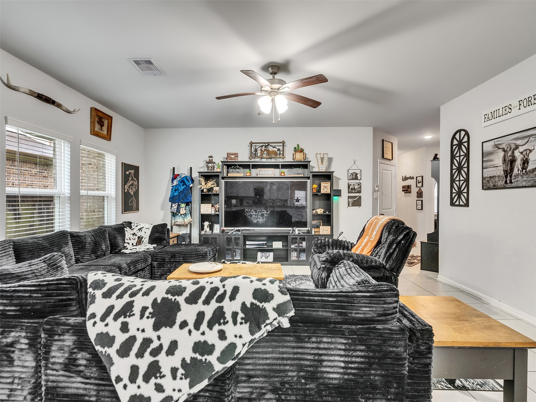 8719 Willet Street Baytown, TX 77521 - Photo 13 of 42 a living room with furniture fireplace and flat screen tv