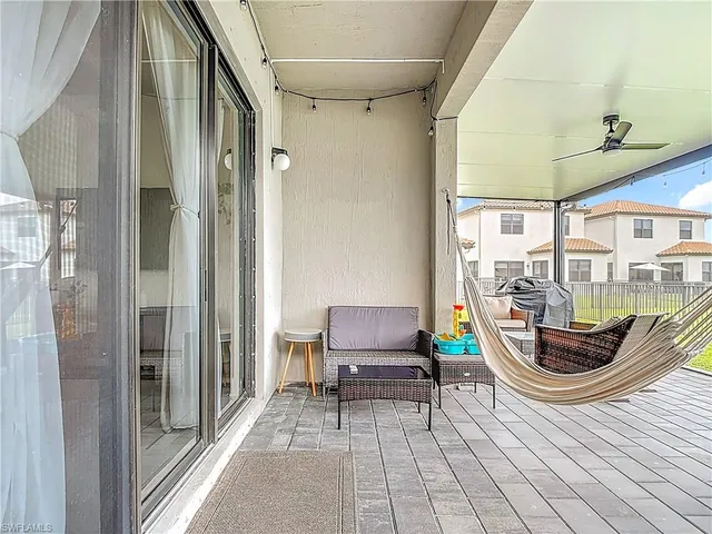 a view of a swimming pool with a lounge chair