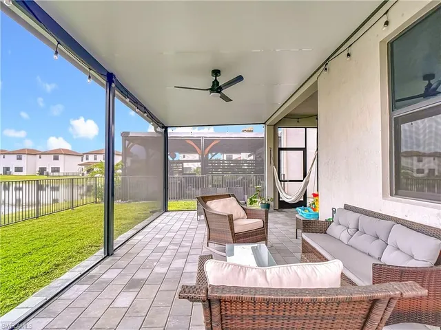 a front view of house with yard and outdoor seating