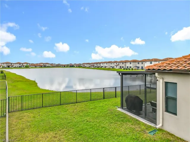 a view of a house with a yard porch and sitting area