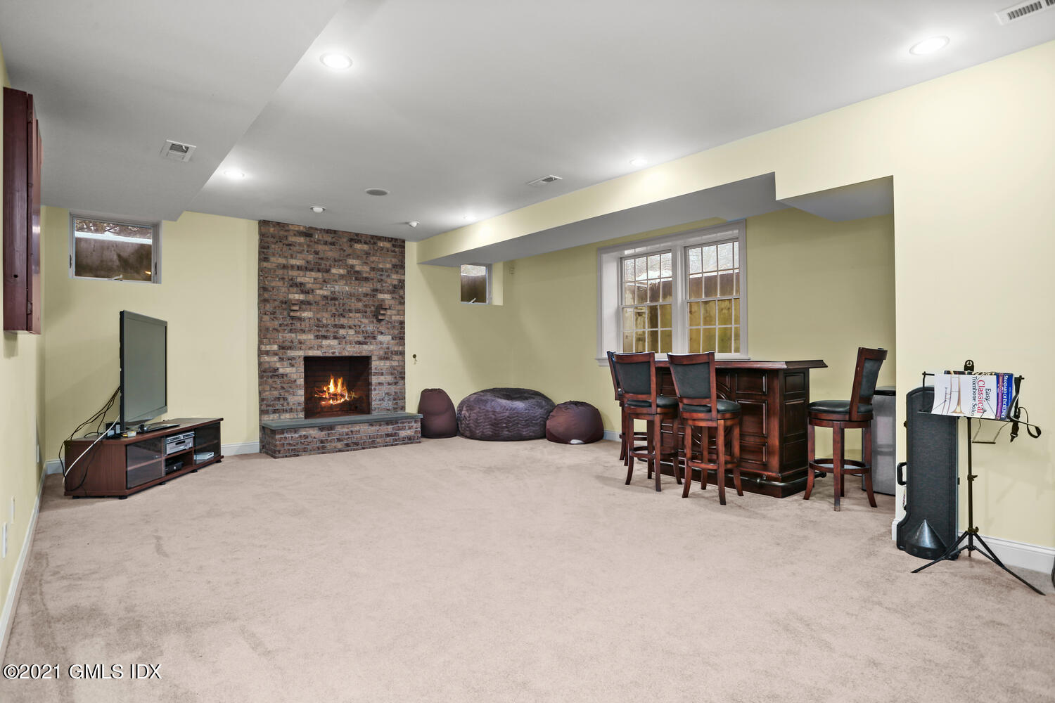 56 Old Orchard Road Riverside, CT 06878 - Photo 29 of 39 a living room with furniture and a fireplace