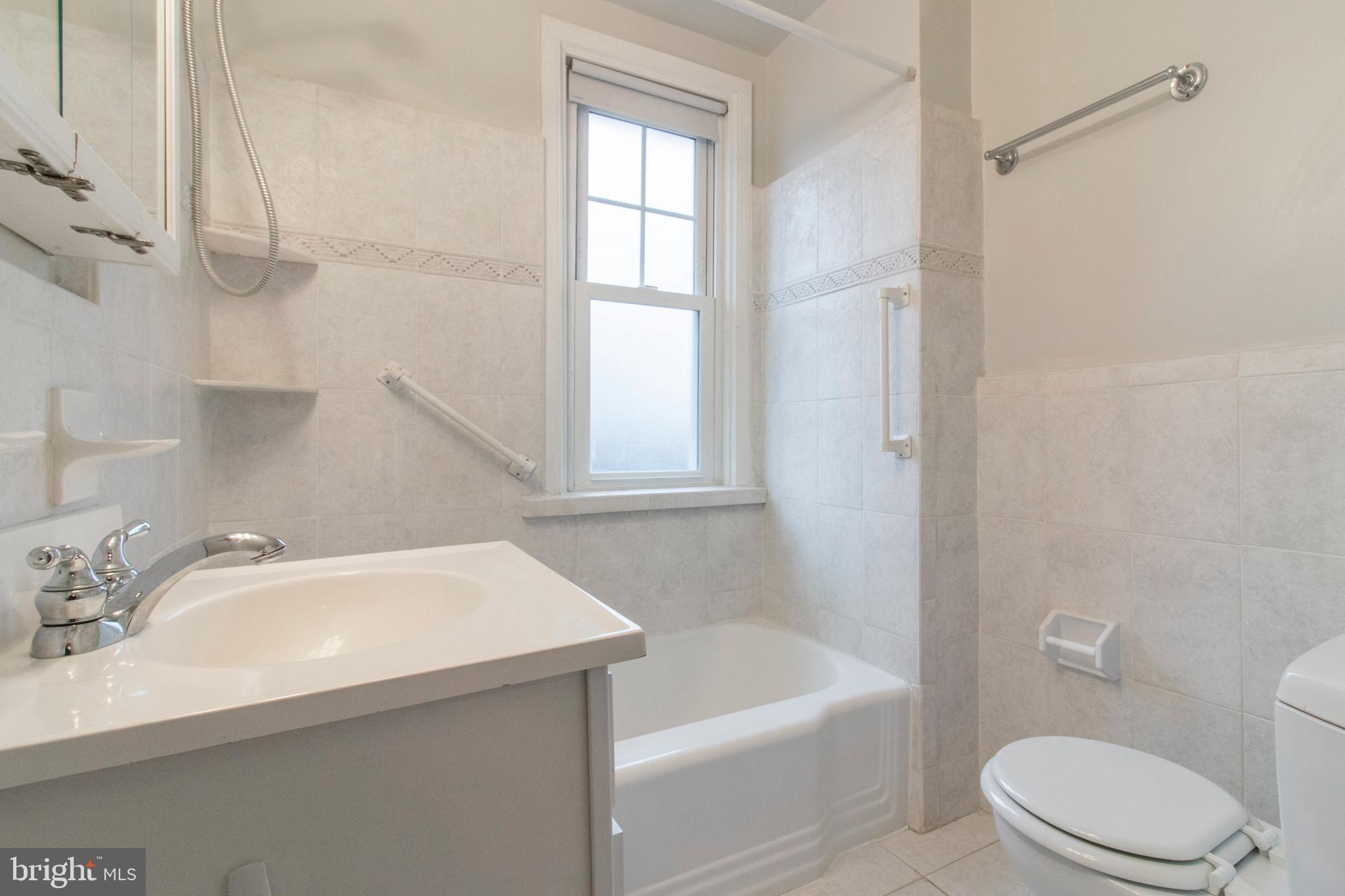 244 Barclay Road Upper Darby, PA 19082 - Photo 16 of 21 a bathroom with a sink a toilet and shower