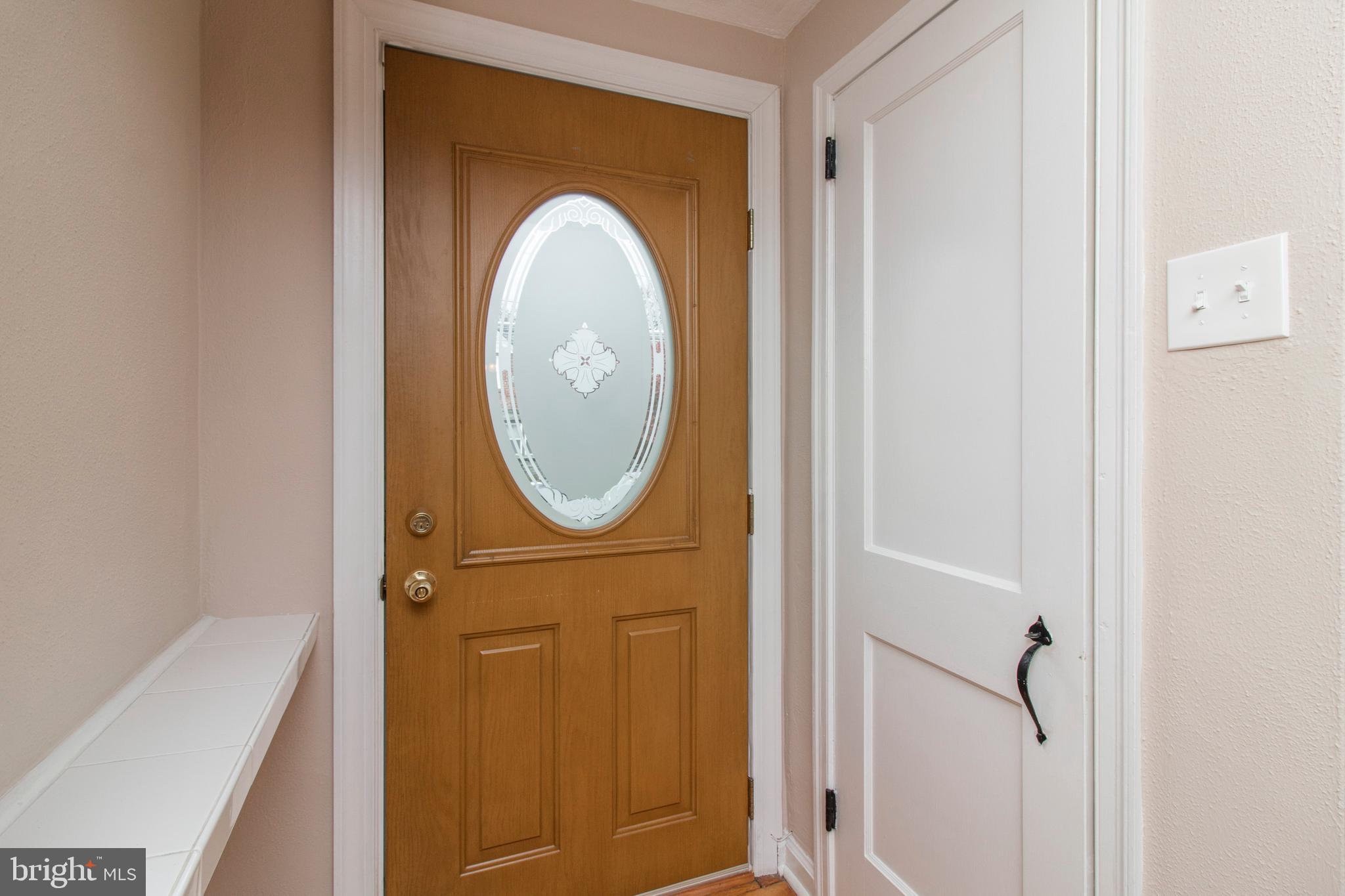 244 Barclay Road Upper Darby, PA 19082 - Photo 3 of 21 a bathroom with a sink a mirror and a shower