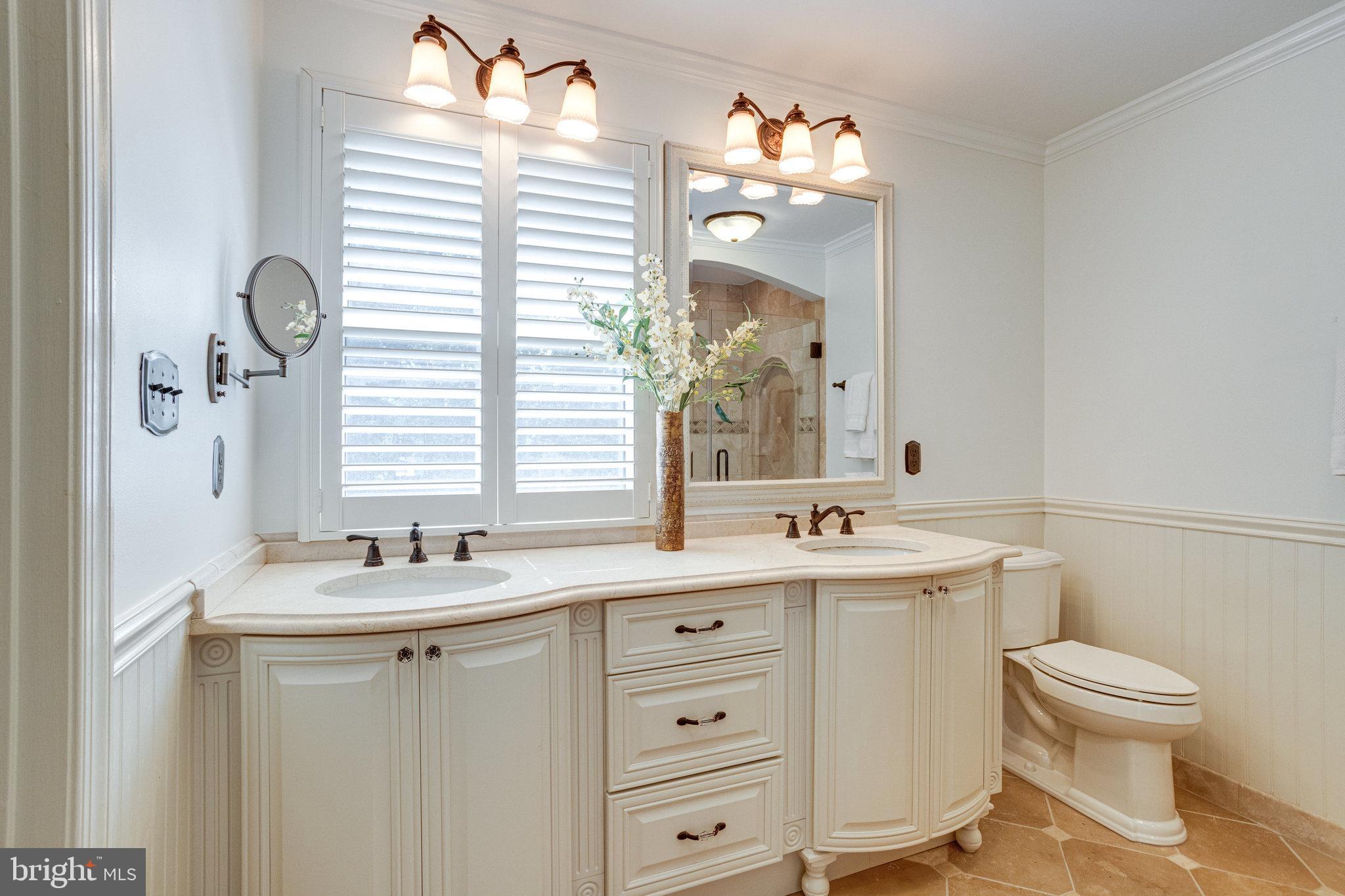 8325 Lindside Way Springfield, VA 22153 - Photo 28 of 63 Elegant bath with double vanity and shutters