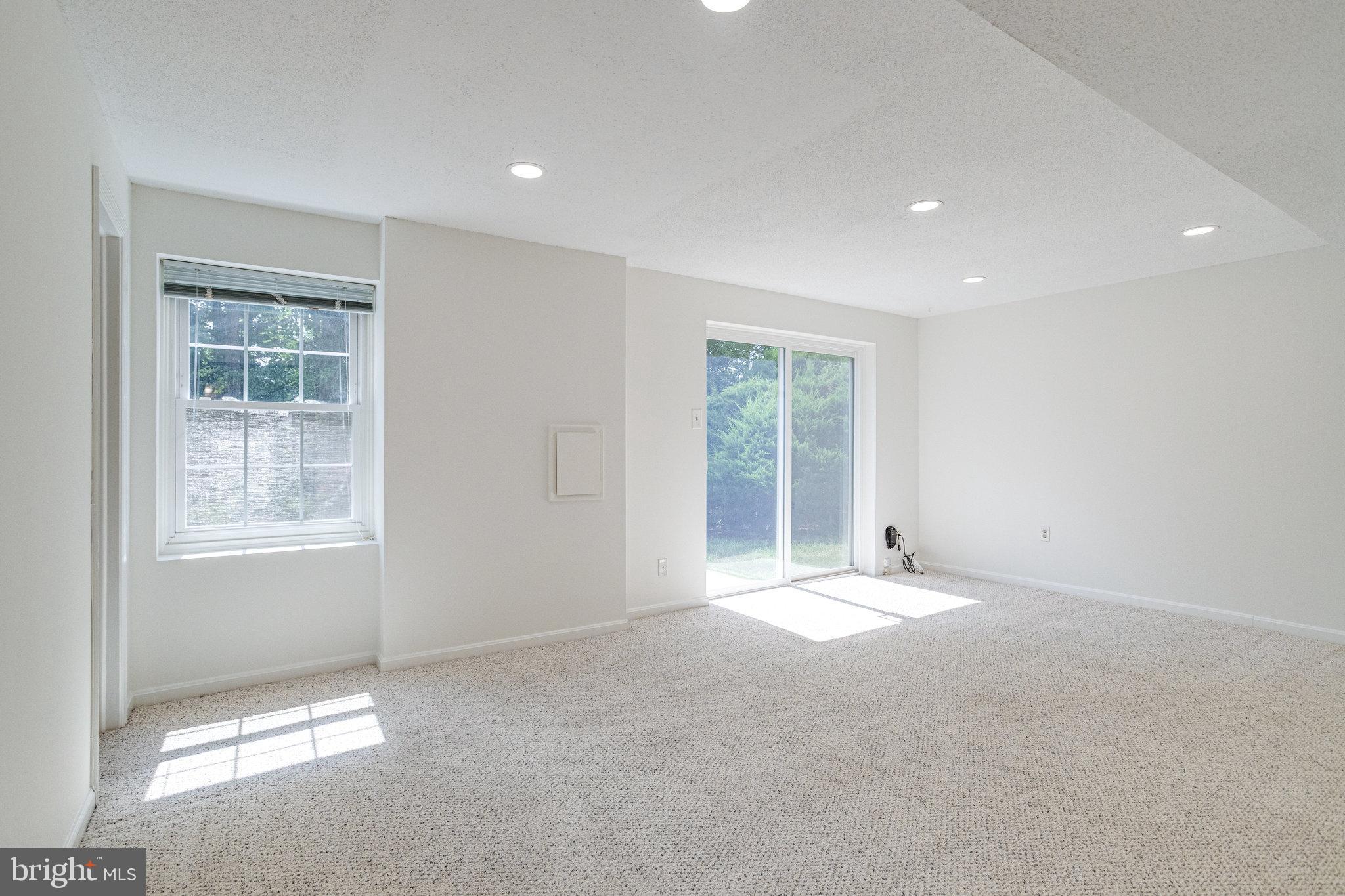 8325 Lindside Way Springfield, VA 22153 - Photo 40 of 63 Walk-out rec room is open and full of light