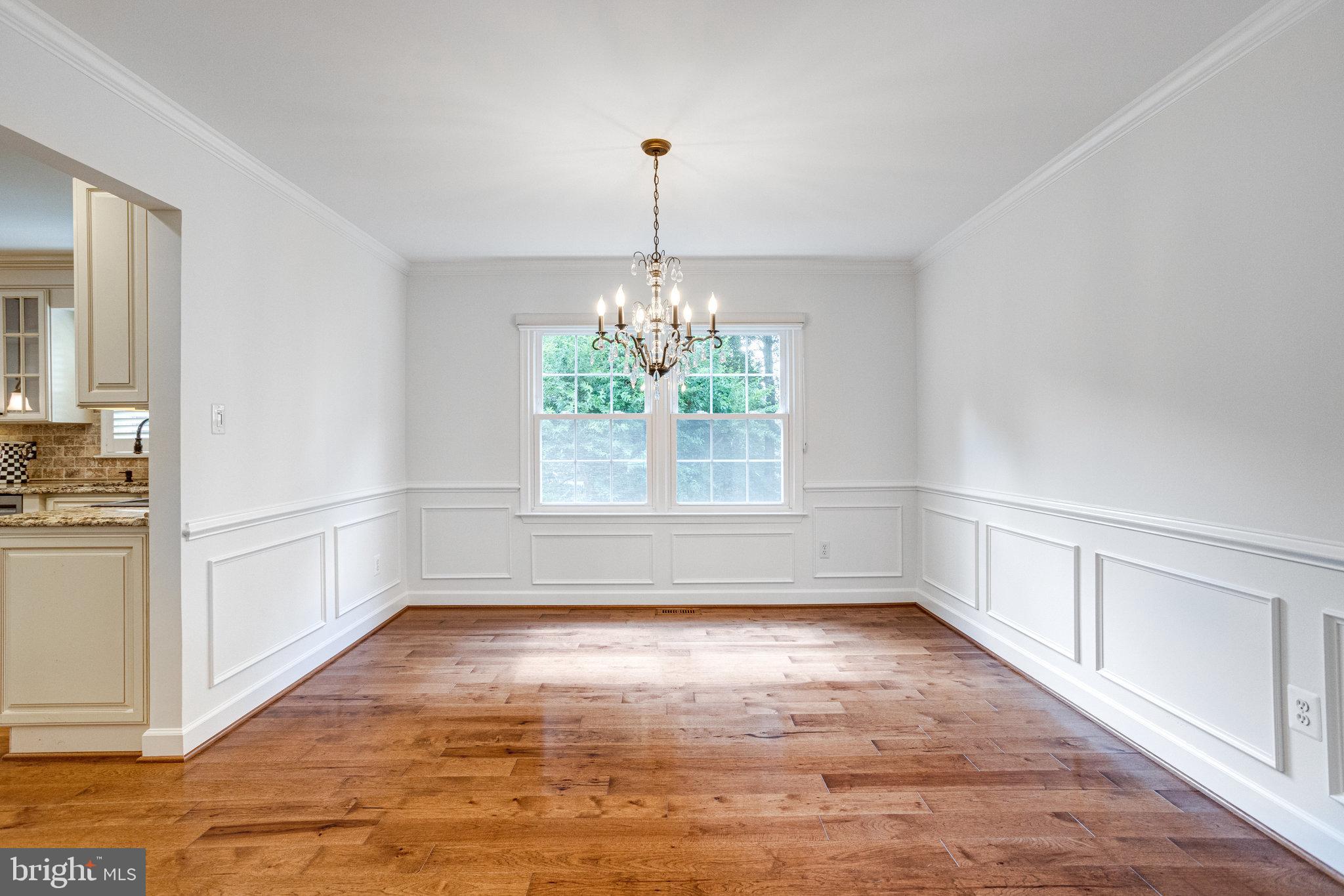 8325 Lindside Way Springfield, VA 22153 - Photo 10 of 63 Dining room with chair rail and wainscoting