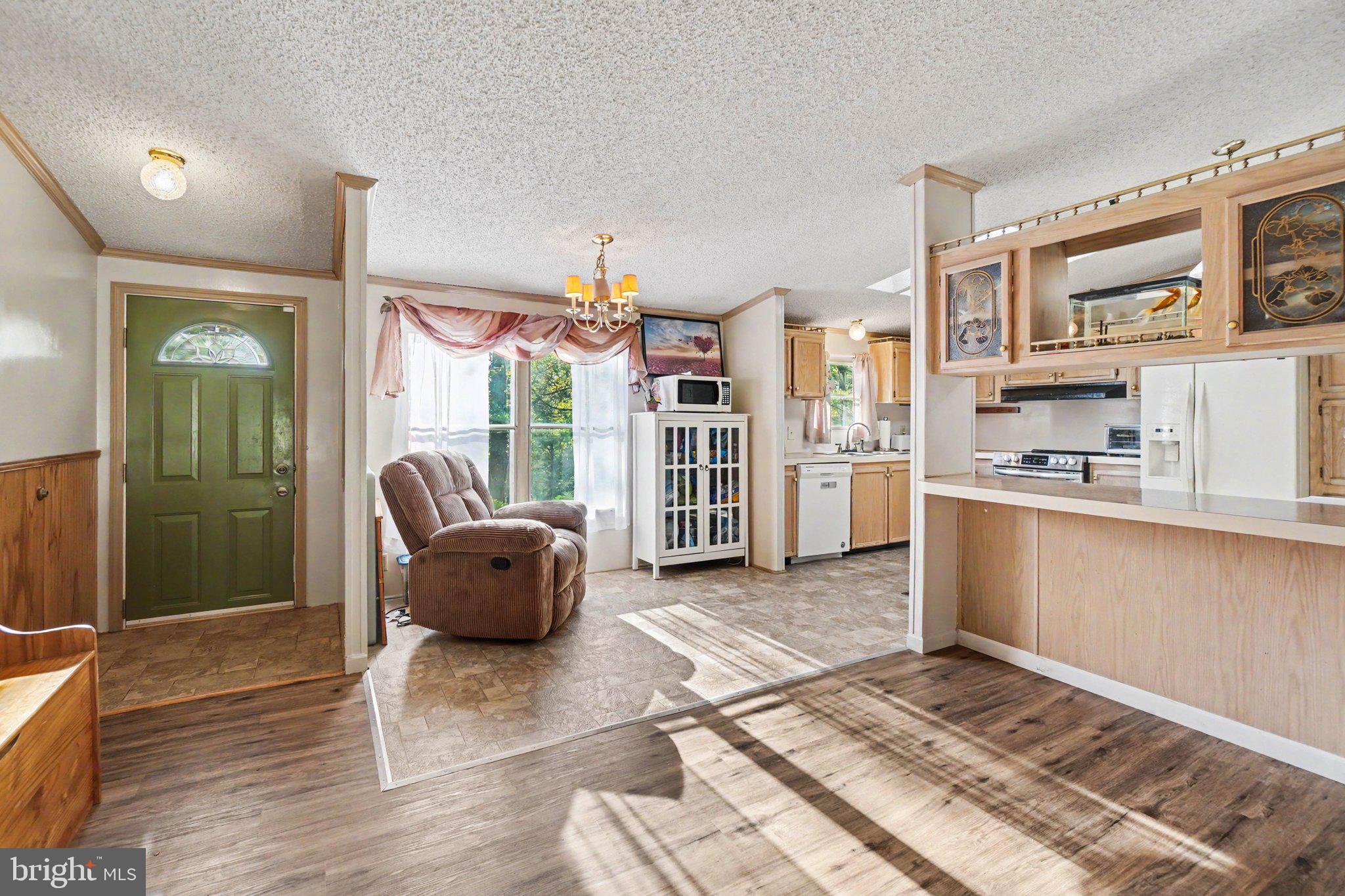 46 Pisgah Rest Shermans Dale, PA 17090 - Photo 7 of 36 a living room with furniture and a open kitchen view