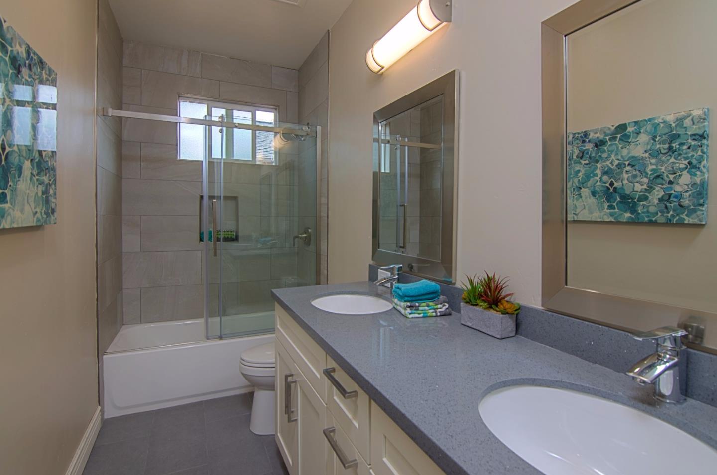 847 Muender Avenue Sunnyvale, CA 94086 - Photo 11 of 15 a bathroom with a granite countertop sink a toilet and shower