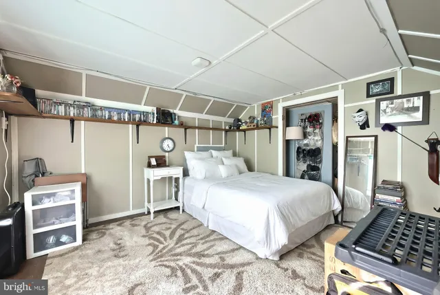 a bedroom with a bed and cabinets