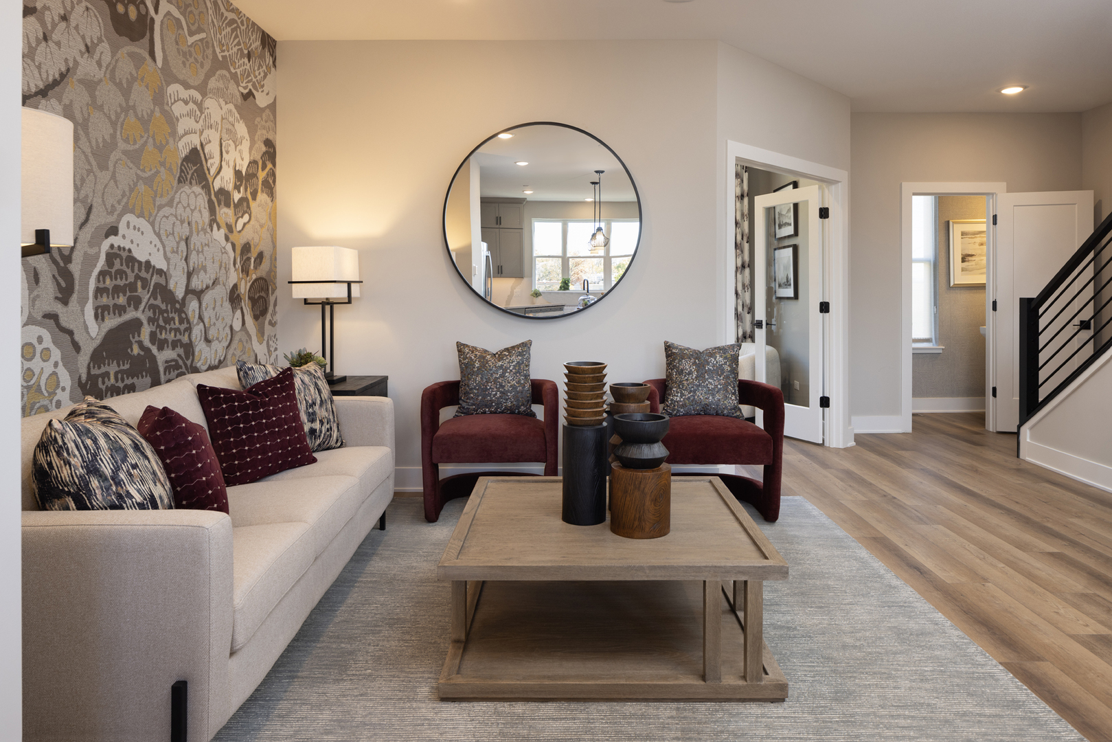 2749 Stone Circle Geneva, IL 60134 - Photo 4 of 9 a living room with furniture a mirror and a wooden floor
