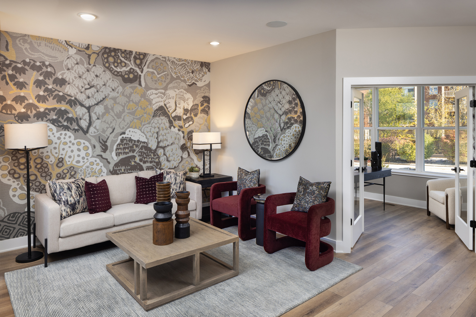 2749 Stone Circle Geneva, IL 60134 - Photo 5 of 9 a living room with furniture a clock on wall and a large window