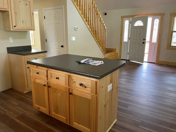 a view of an entryway with wooden floor