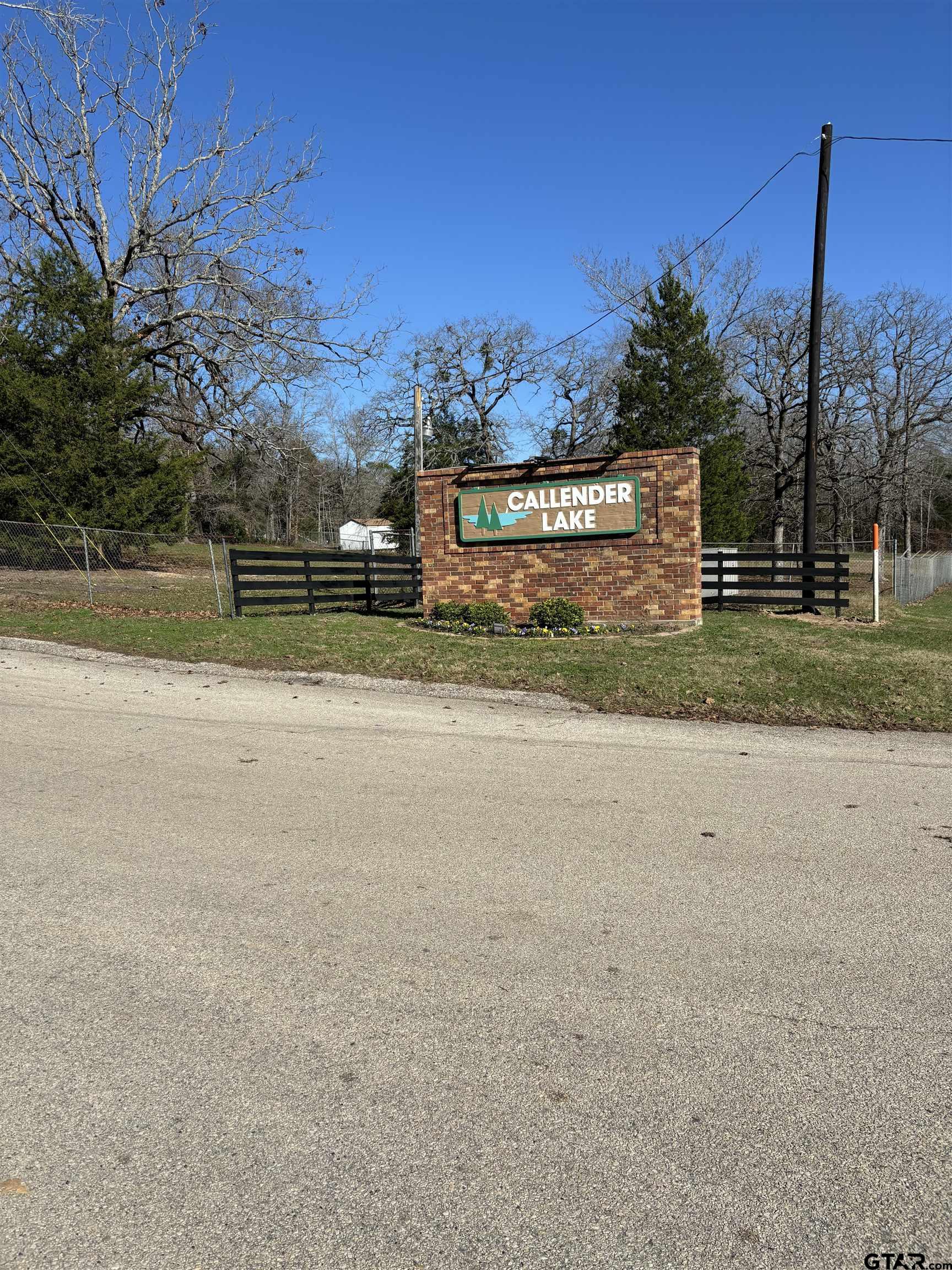 Lot 25 Briar Grove Road Murchison, TX 75778 - Photo 1 of 3 a view of a field with a sign board
