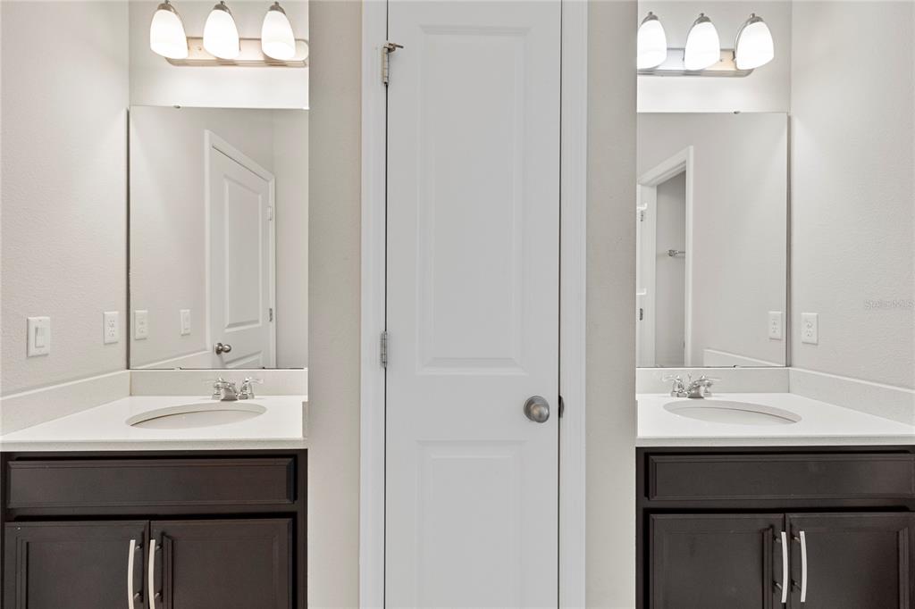 8764 Powder Ridge Trail Windermere, FL 34786 - Photo 34 of 43 a bathroom with a sink and a mirror