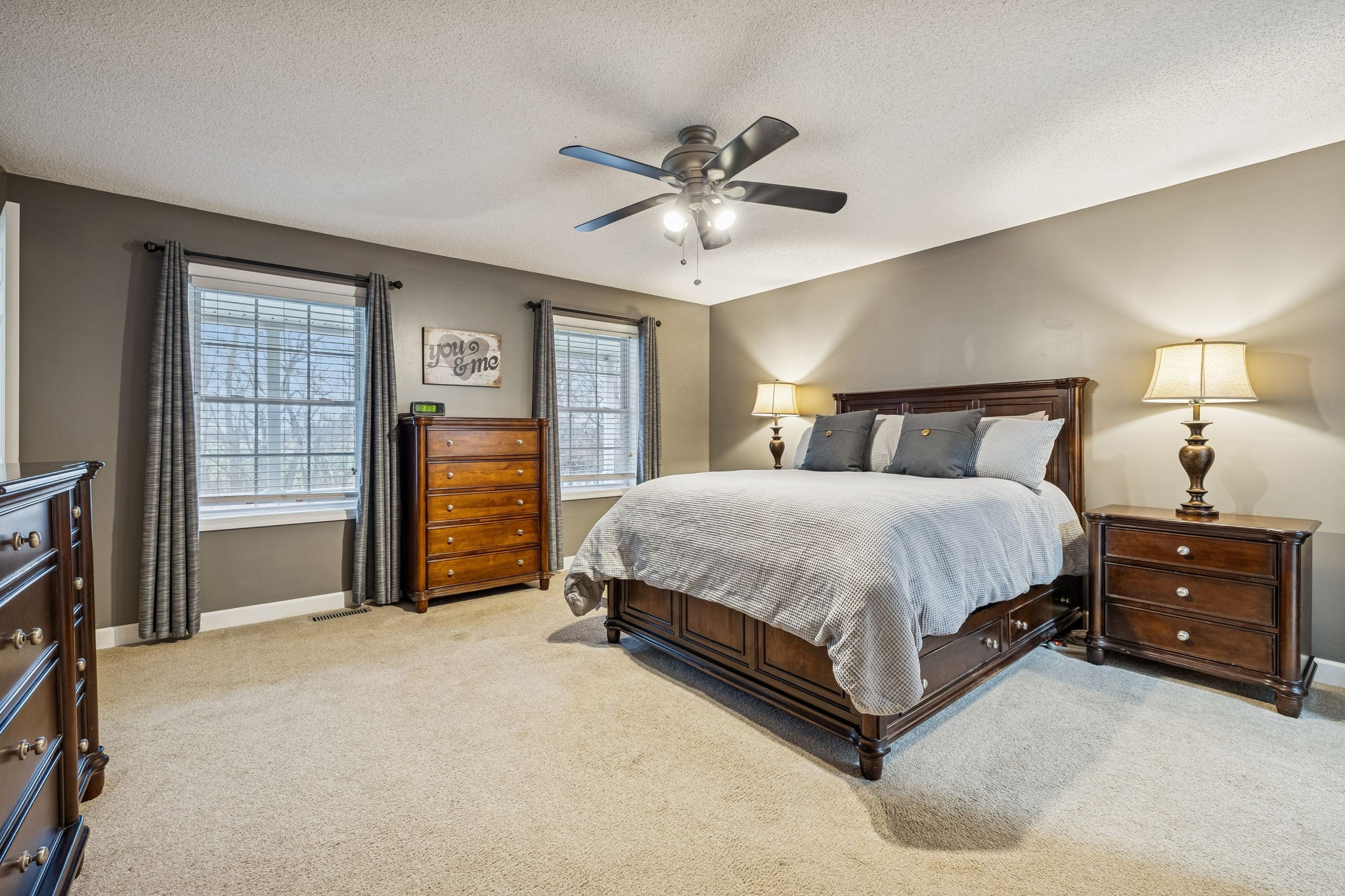7697 Bethany Church Road Orlinda, TN 37141 - Photo 12 of 96 a spacious bedroom with a bed and a chandelier
