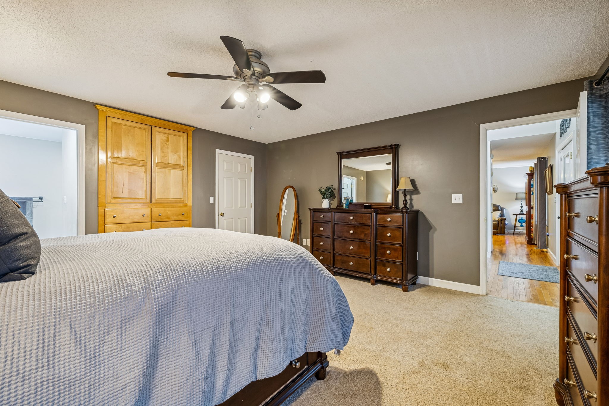 7697 Bethany Church Road Orlinda, TN 37141 - Photo 13 of 96 a bedroom with a bed and a chandelier