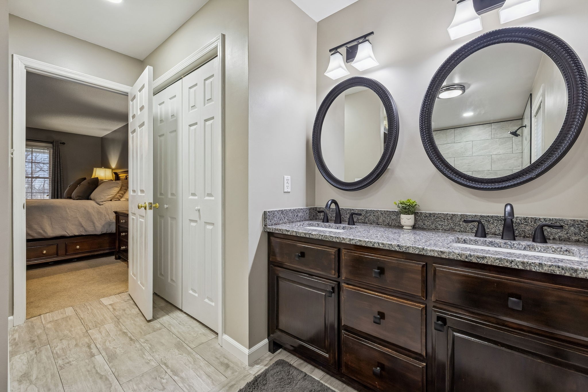 7697 Bethany Church Road Orlinda, TN 37141 - Photo 14 of 96 a en suite bathroom with a granite countertop double vanity sink and a mirror