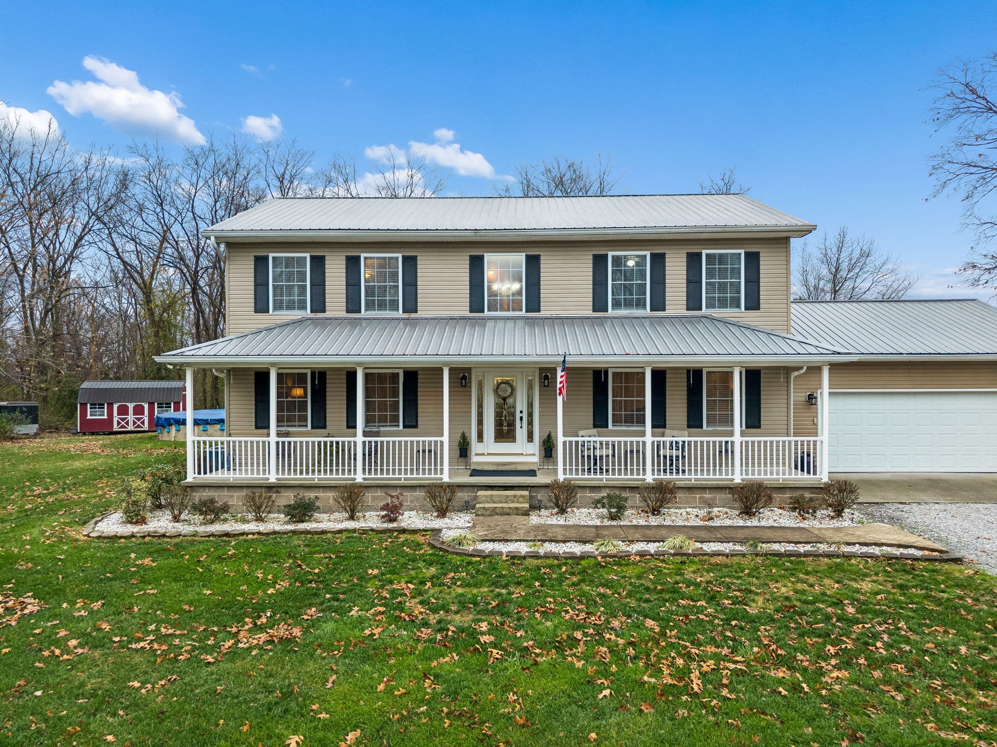 7697 Bethany Church Road Orlinda, TN 37141 - Photo 2 of 96 a front view of a house with a yard table and chairs