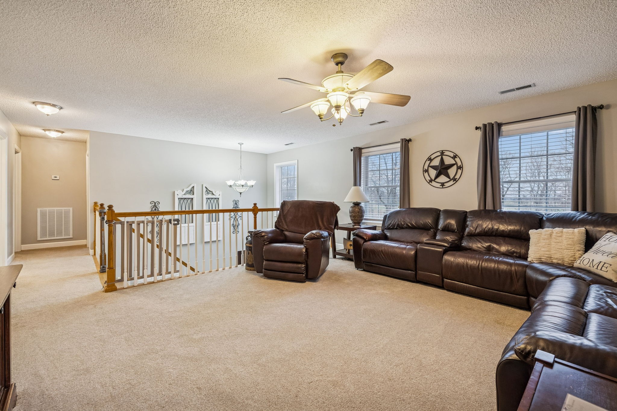 7697 Bethany Church Road Orlinda, TN 37141 - Photo 22 of 96 a living room with furniture and a chandelier