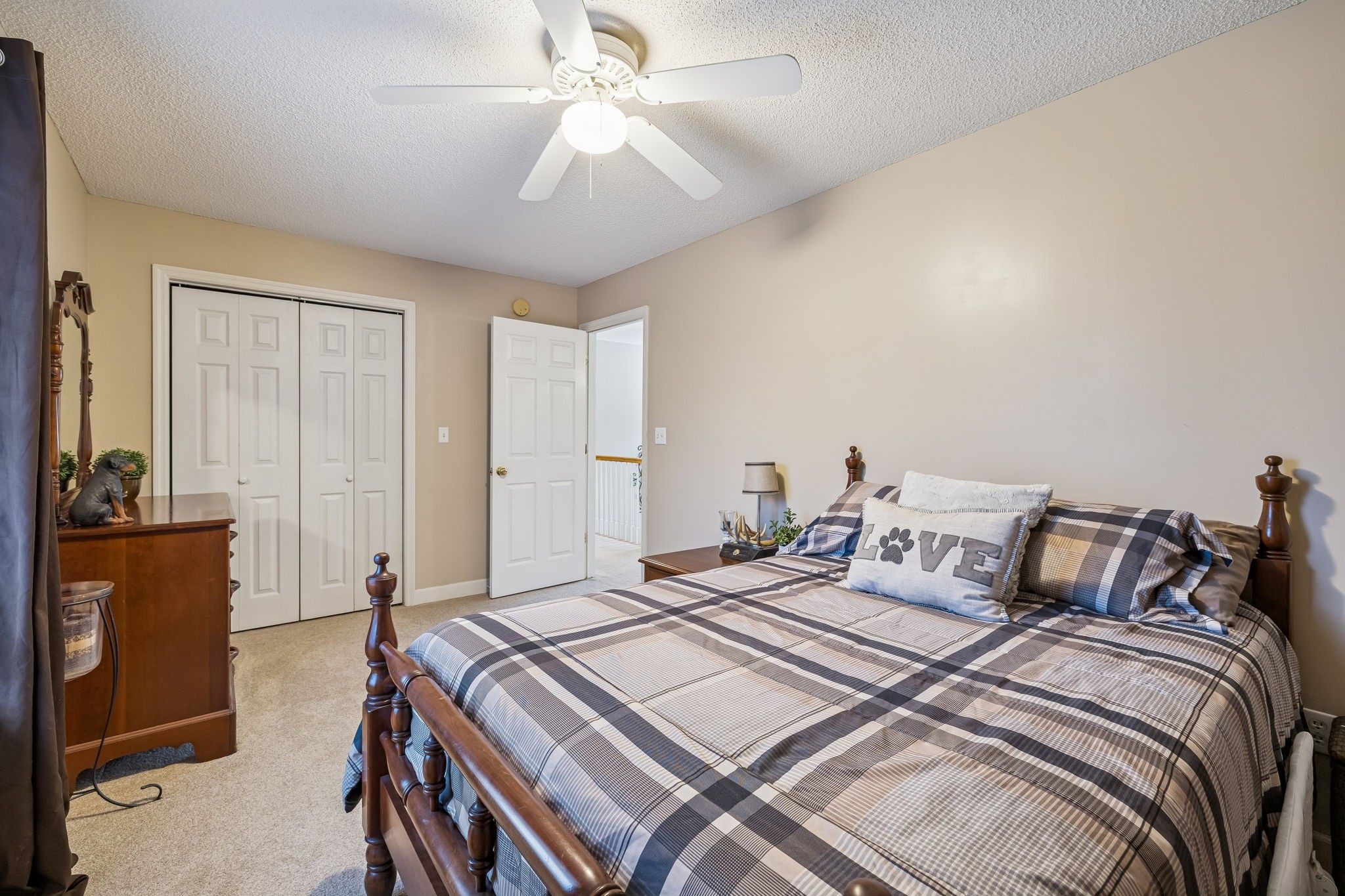 7697 Bethany Church Road Orlinda, TN 37141 - Photo 25 of 96 a bedroom with double bed and a chandelier