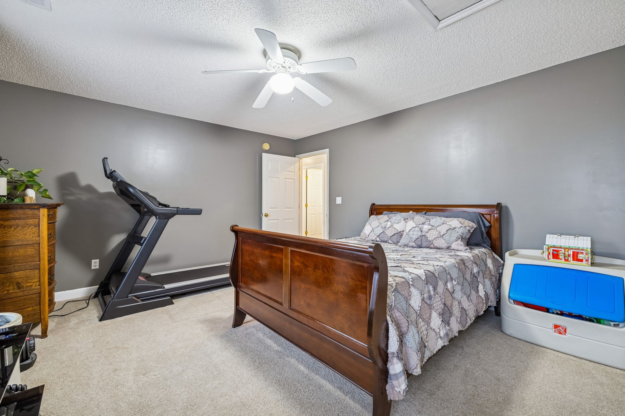 7697 Bethany Church Road Orlinda, TN 37141 - Photo 30 of 96 a bed room with a bed and a ceiling fan