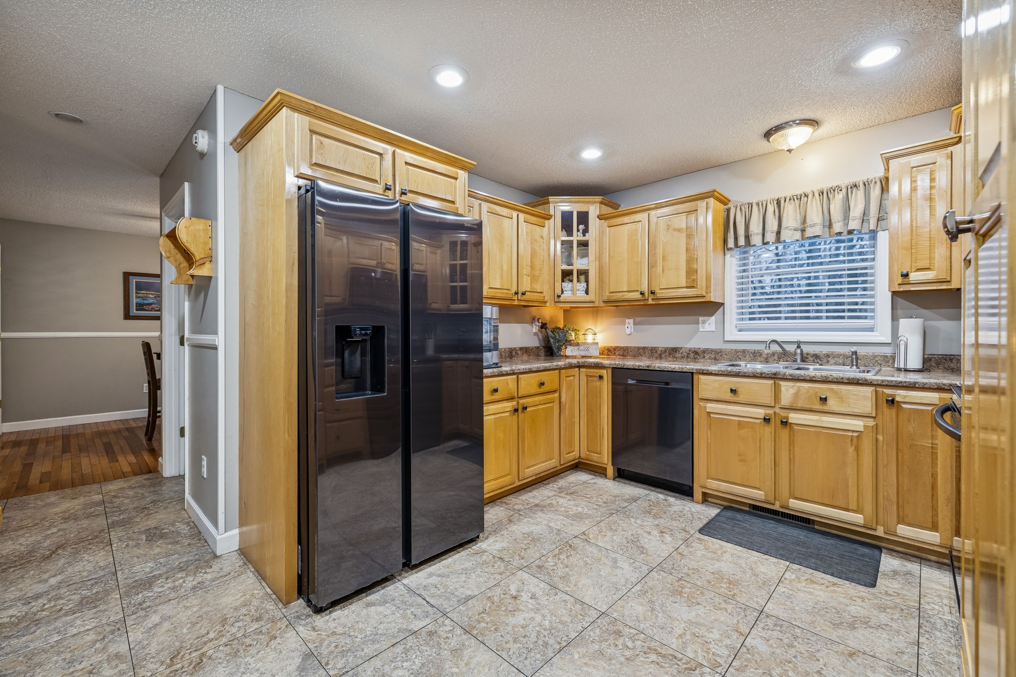 7697 Bethany Church Road Orlinda, TN 37141 - Photo 37 of 96 a kitchen with stainless steel appliances granite countertop a refrigerator and a sink