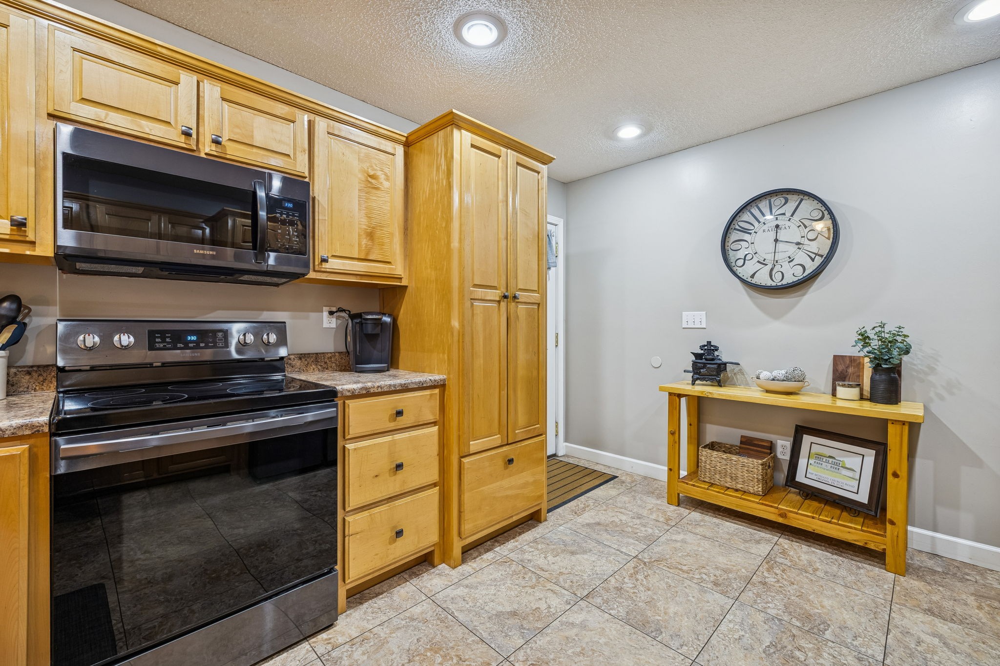 7697 Bethany Church Road Orlinda, TN 37141 - Photo 39 of 96 a kitchen with stainless steel appliances granite countertop a stove and a refrigerator