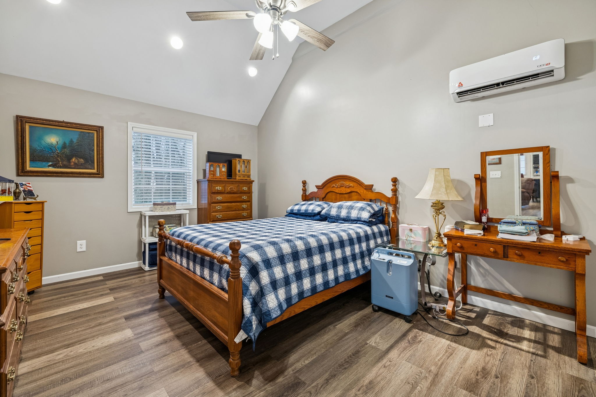 7697 Bethany Church Road Orlinda, TN 37141 - Photo 50 of 96 a bedroom with a bed and wooden floor