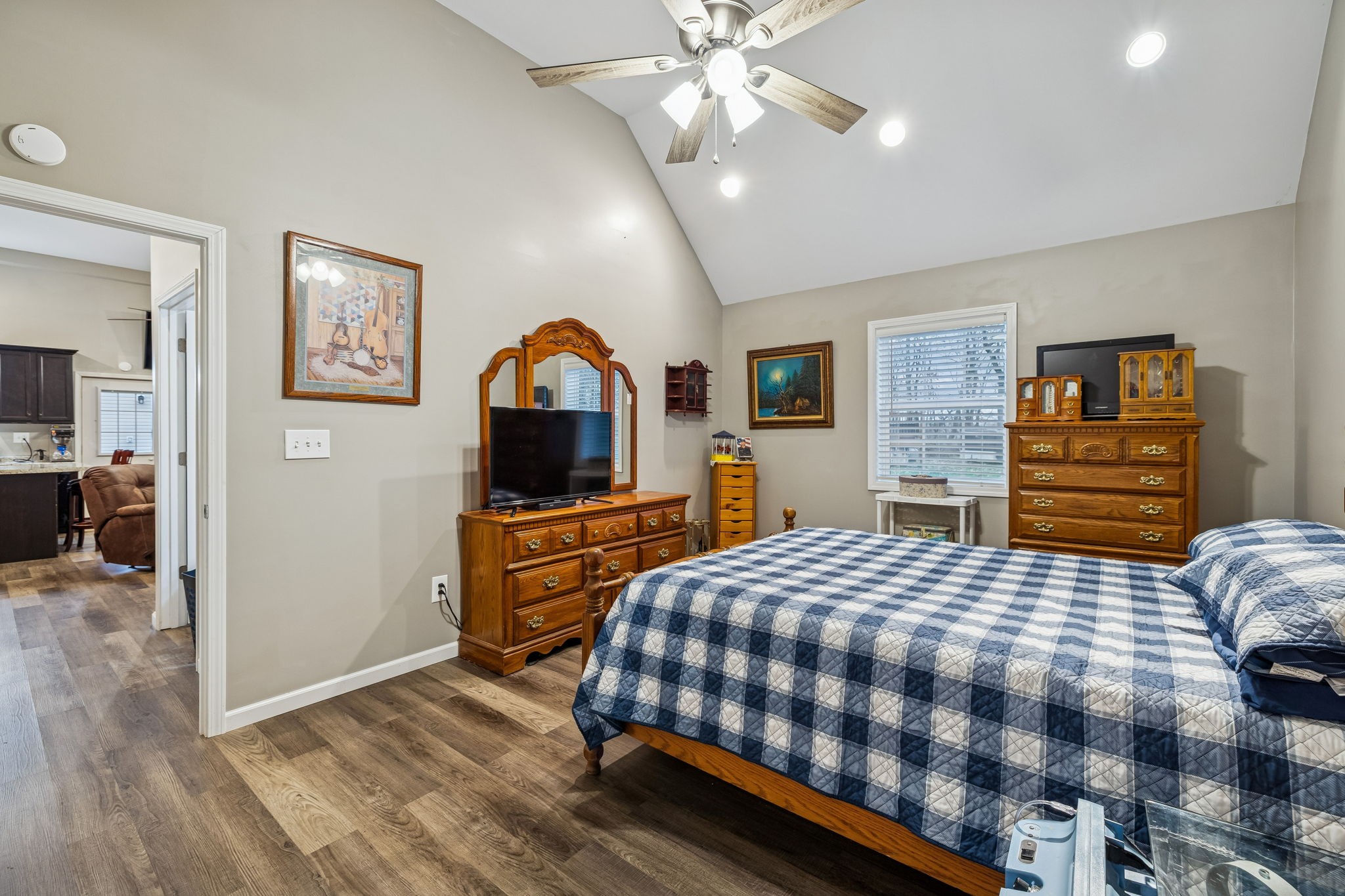 7697 Bethany Church Road Orlinda, TN 37141 - Photo 51 of 96 a bedroom with a bed and dresser with mirror