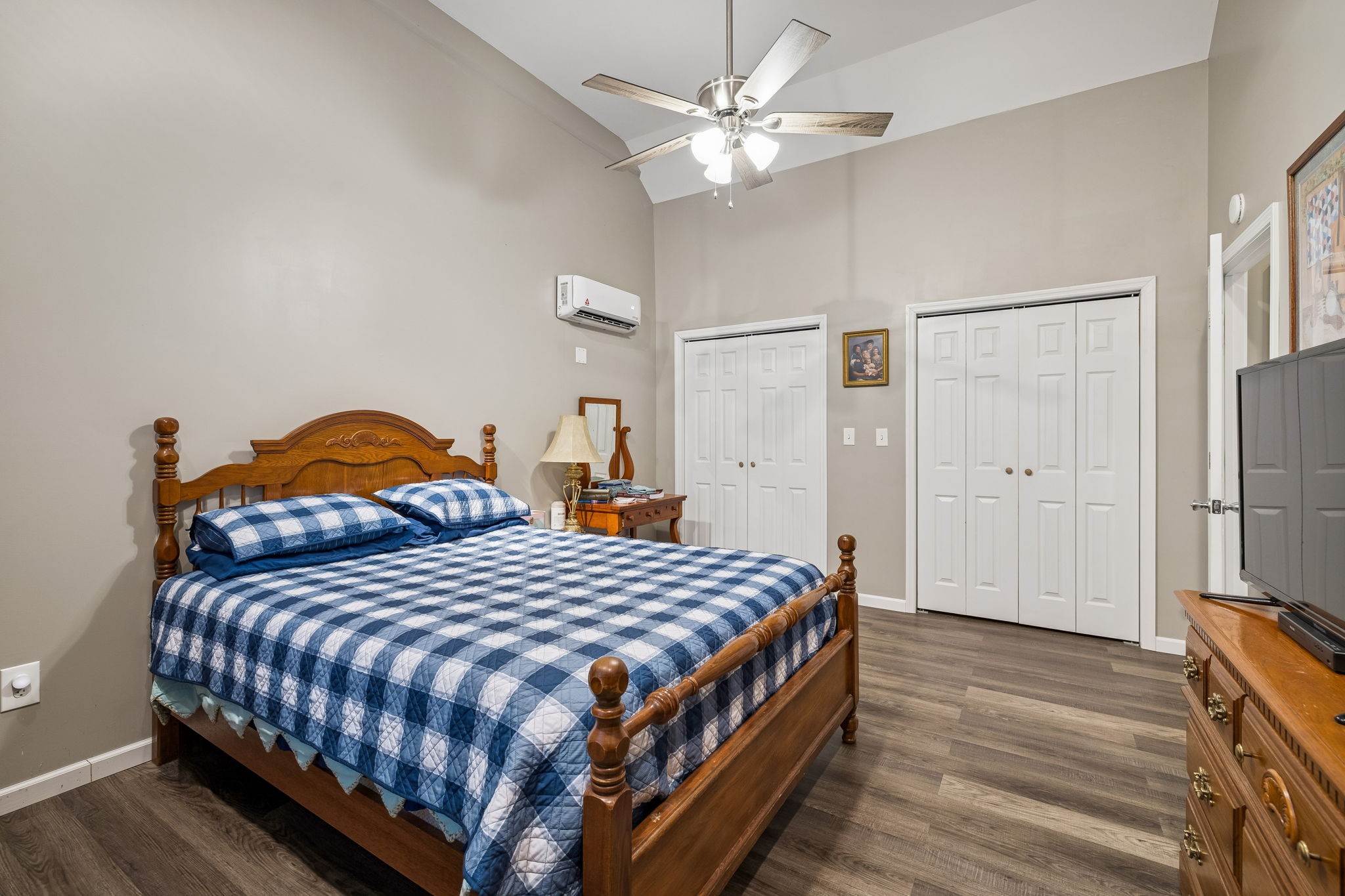 7697 Bethany Church Road Orlinda, TN 37141 - Photo 52 of 96 a bedroom with a bed and a chandelier