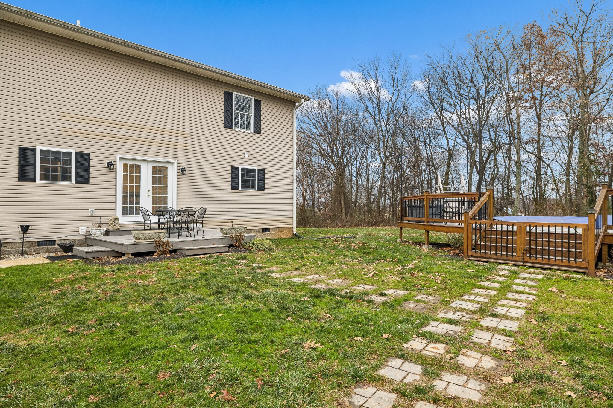 7697 Bethany Church Road Orlinda, TN 37141 - Photo 63 of 96 a backyard of a house with table and chairs