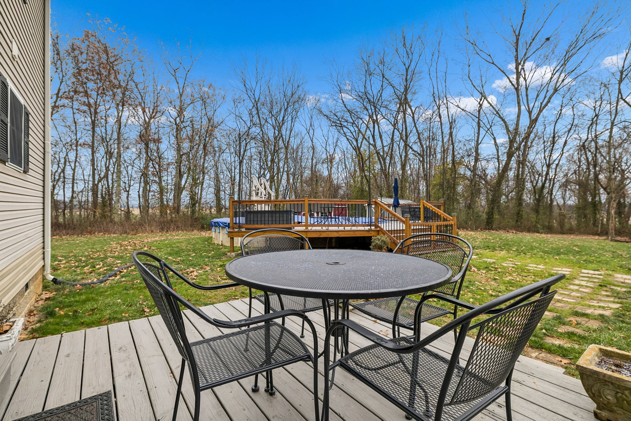 7697 Bethany Church Road Orlinda, TN 37141 - Photo 65 of 96 a backyard of a house with table and chairs