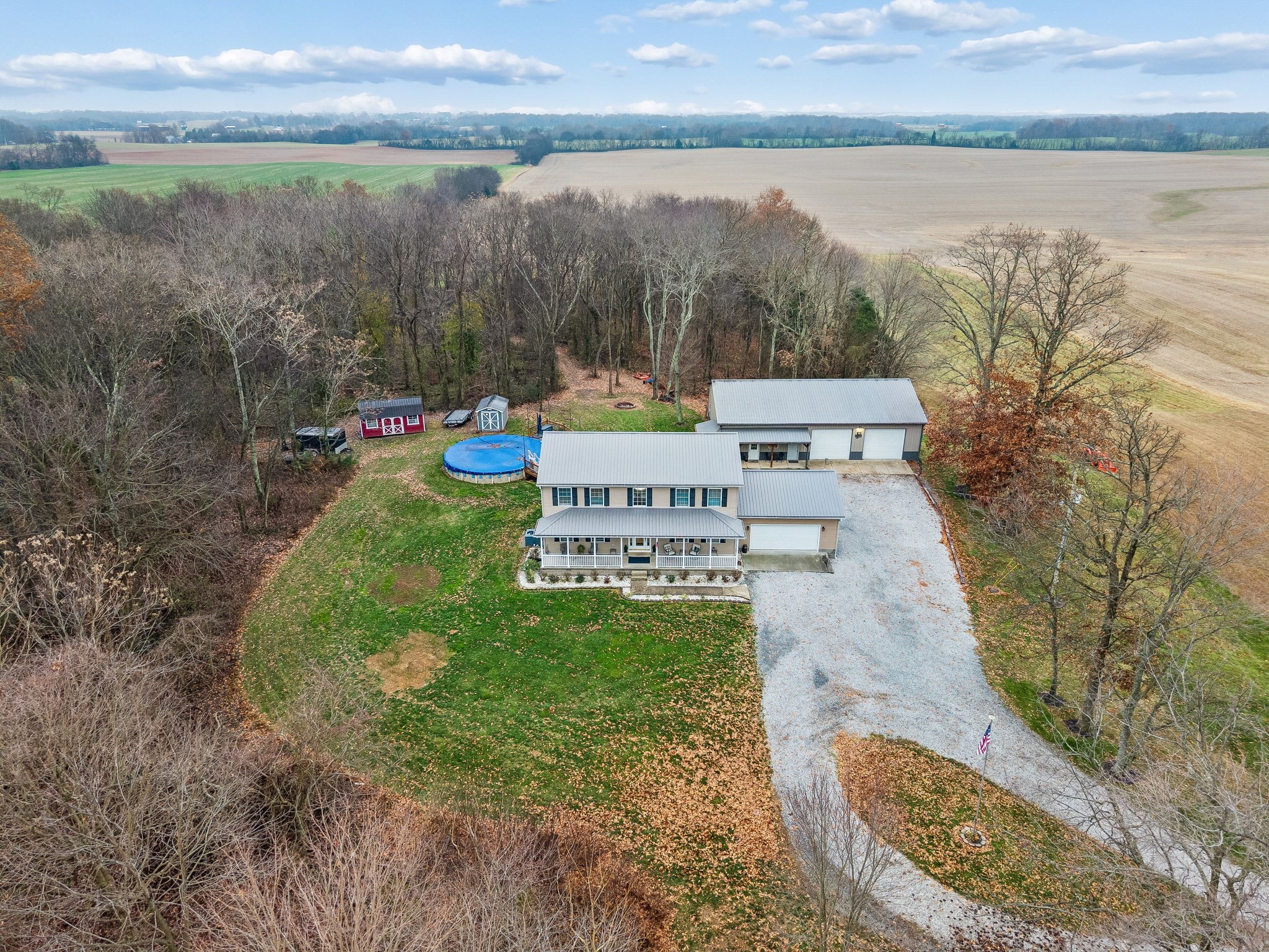 7697 Bethany Church Road Orlinda, TN 37141 - Photo 71 of 96 a view of a lake with a yard and large trees