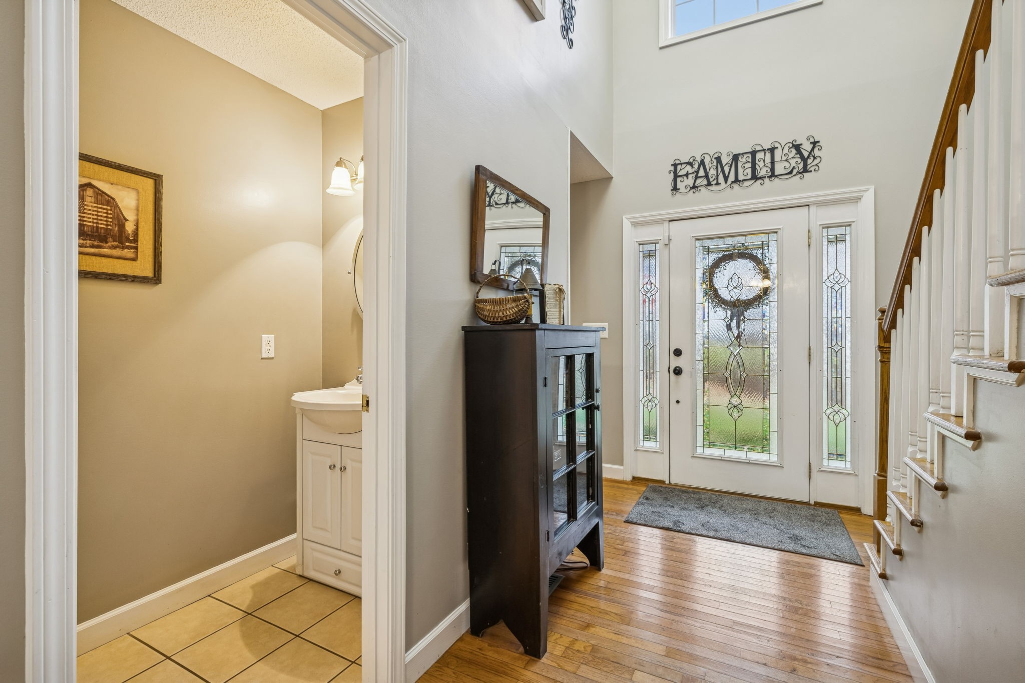 7697 Bethany Church Road Orlinda, TN 37141 - Photo 9 of 96 a view of a hallway with wooden floor windows and a bathroom