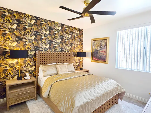 a bathroom with a granite countertop sink toilet tub and shower