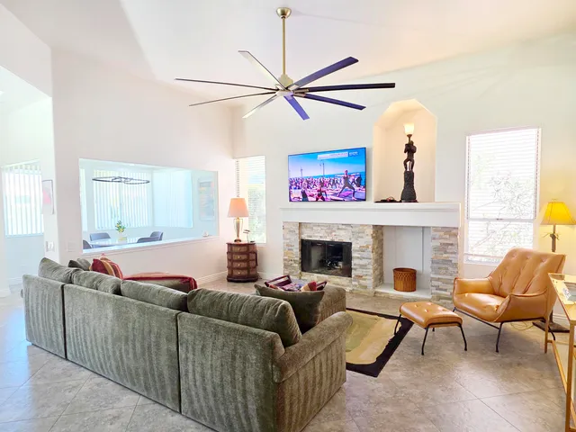 a living room with furniture and a fireplace