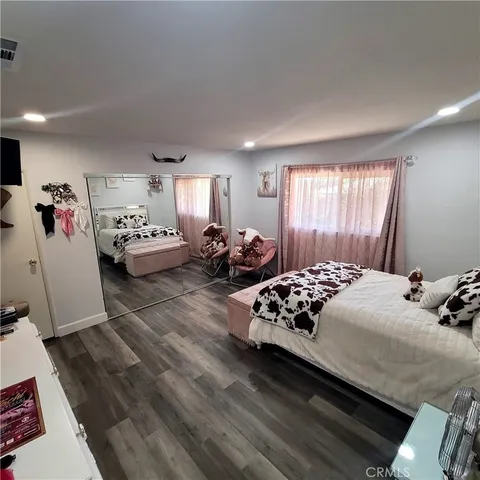 a bedroom with bed and window