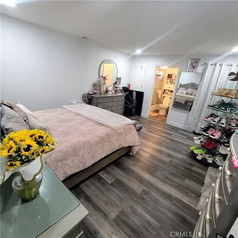 a bedroom with bed and window