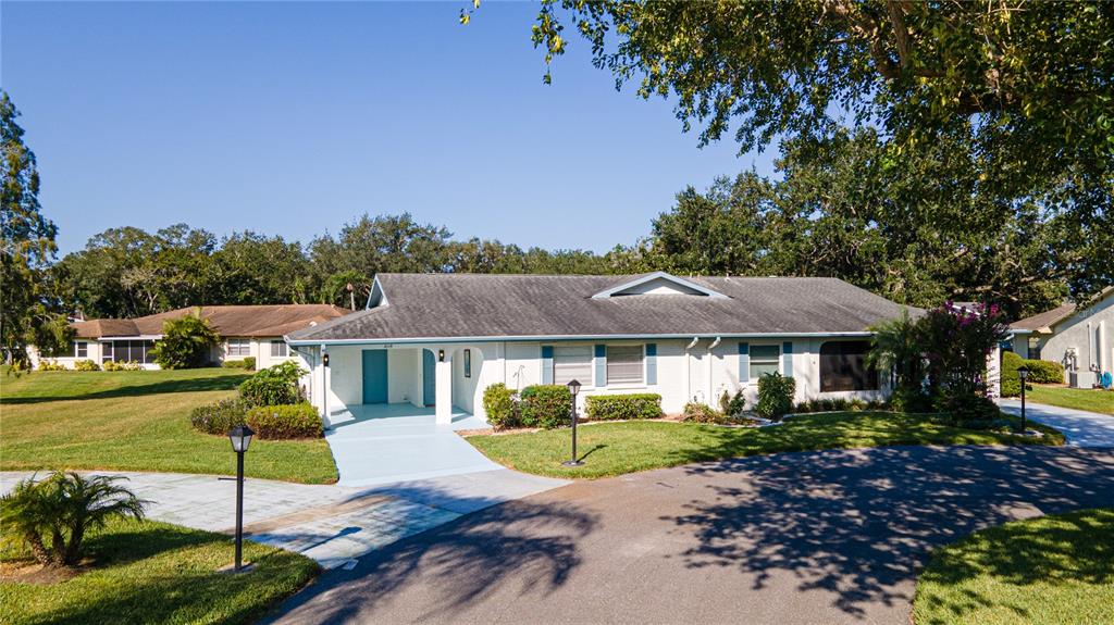 a view of a house with a backyard