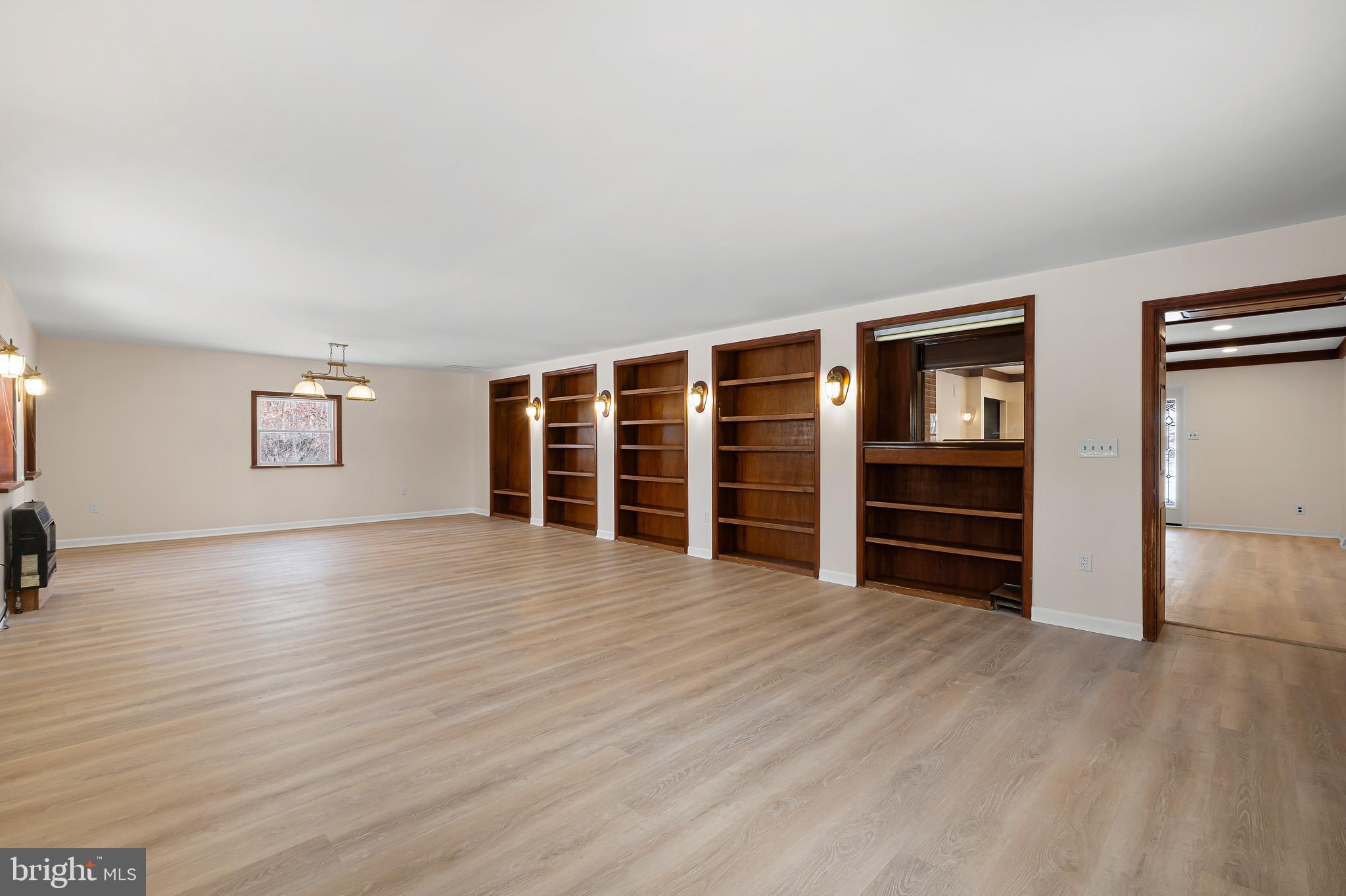 2920 Cheshire Road Wilmington, DE 19810 - Photo 13 of 34 a view of wooden floor and windows in a room