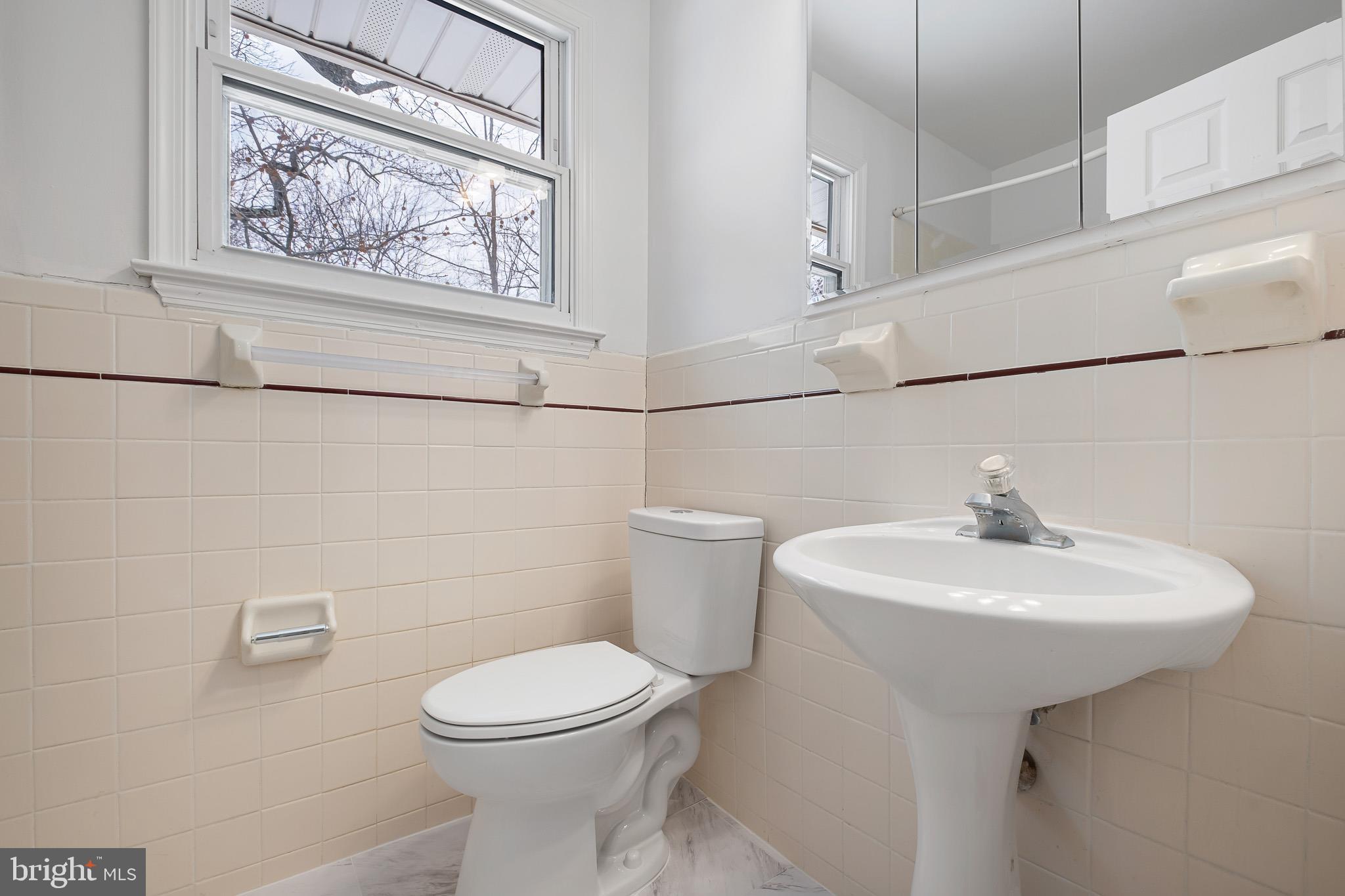 2920 Cheshire Road Wilmington, DE 19810 - Photo 22 of 34 a bathroom with a sink mirror and toilet