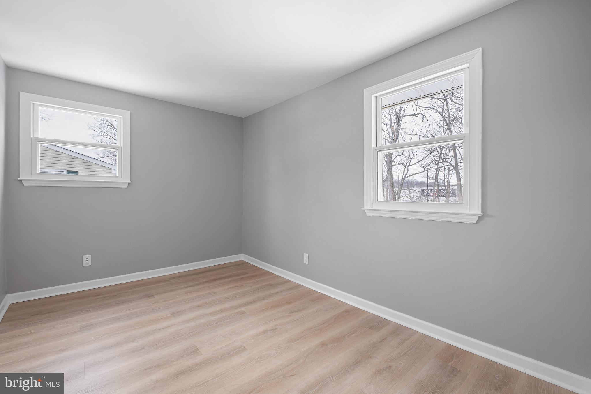2920 Cheshire Road Wilmington, DE 19810 - Photo 23 of 34 a view of a big room with wooden floor and windows
