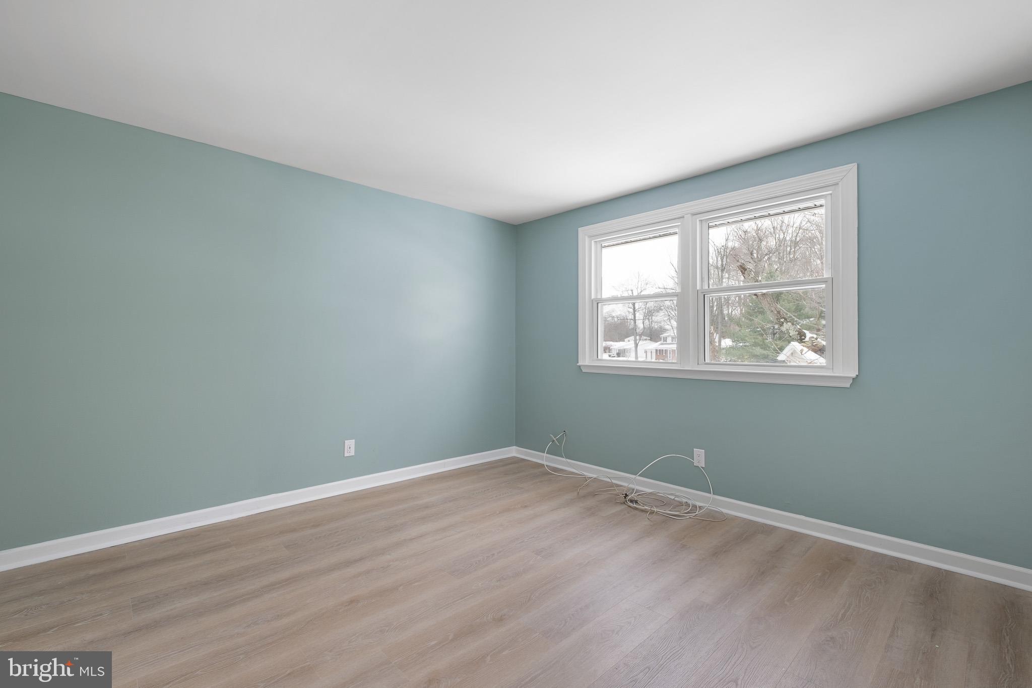 2920 Cheshire Road Wilmington, DE 19810 - Photo 25 of 34 an empty room with wooden floor and windows