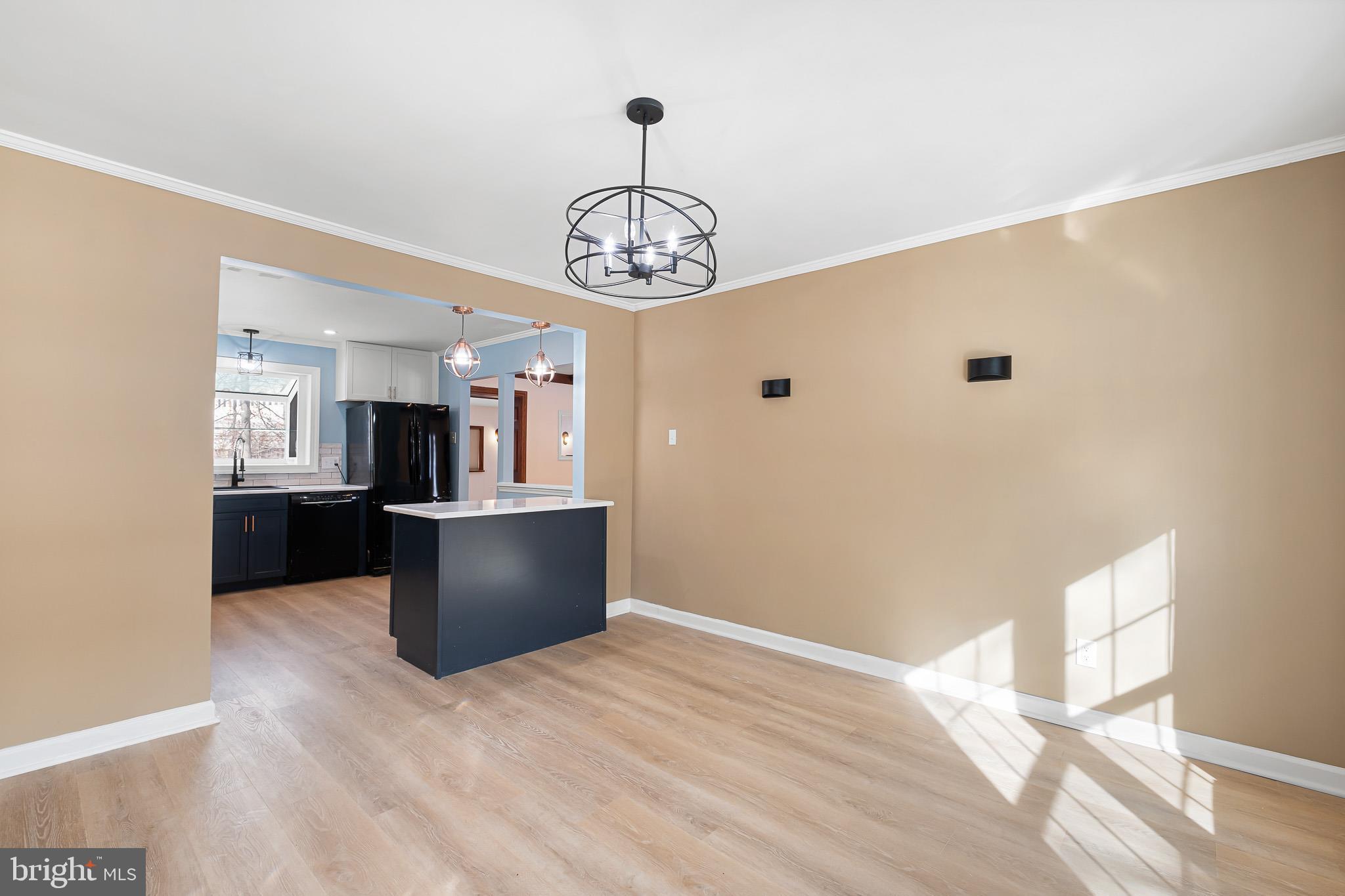 2920 Cheshire Road Wilmington, DE 19810 - Photo 6 of 34 a view of a kitchen with a sink and dishwasher a refrigerator with wooden floor