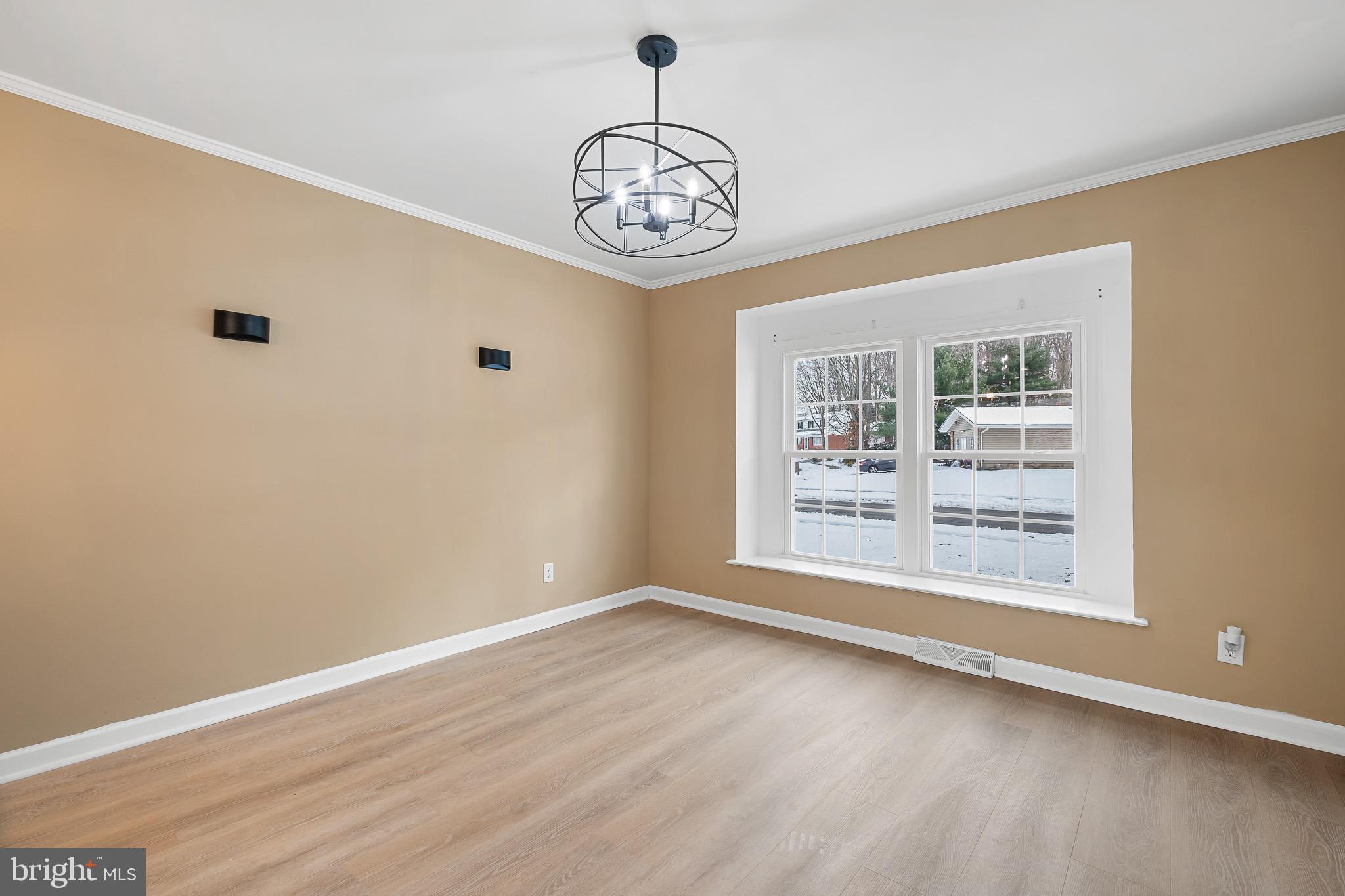 2920 Cheshire Road Wilmington, DE 19810 - Photo 7 of 34 a view of an empty room with a window and wooden floor