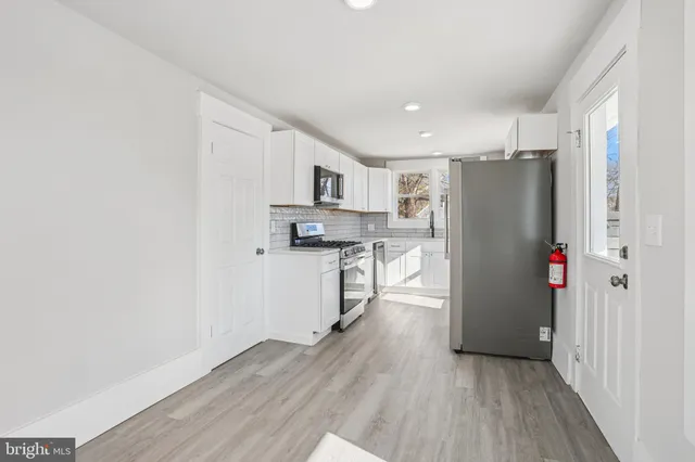 a view of entryway with wooden floor