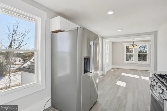 a view of room with window and wooden floor